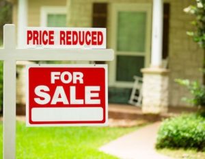 price reduced home sale sign 